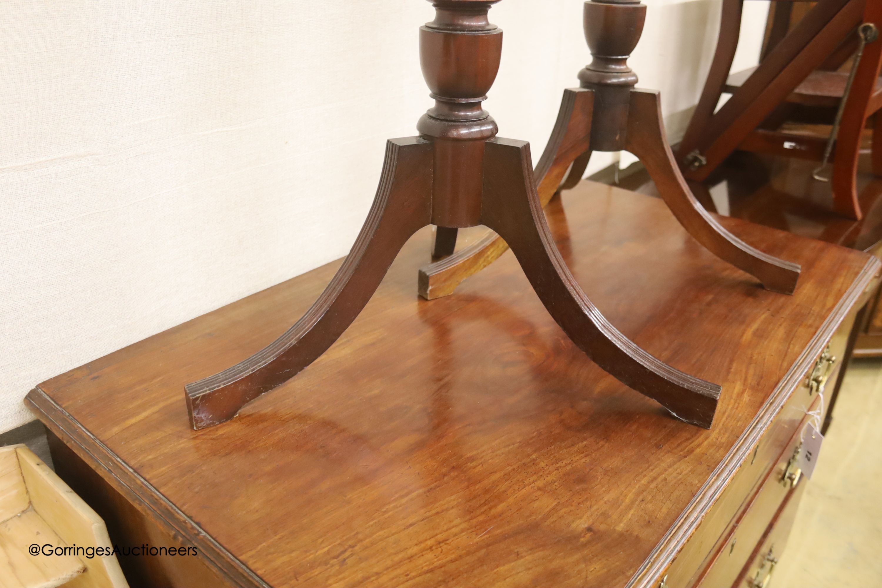 A near pair of reproduction mahogany torcheres, larger 100cm high